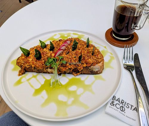 Spicy tofu scramble on sourdough at Barista & Co - Sarit Centre in Nairobi