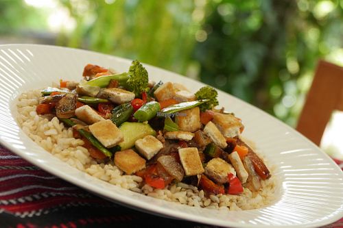Our tasty Stir-fries are packed with veggies and good flavours like garlic ginger and soy sauce. We make them with either tofu, bean sprouts or our spicy Tandoori Tempeh. This photo shows the tofu at Fifth Dimension Cafe in San Pedro La Laguna