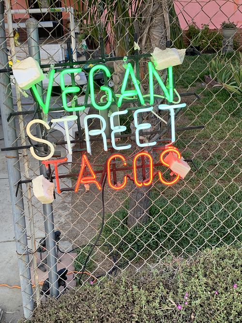 Vegan street tacos sign walking to taco stall  at hippiestacos in Long Beach