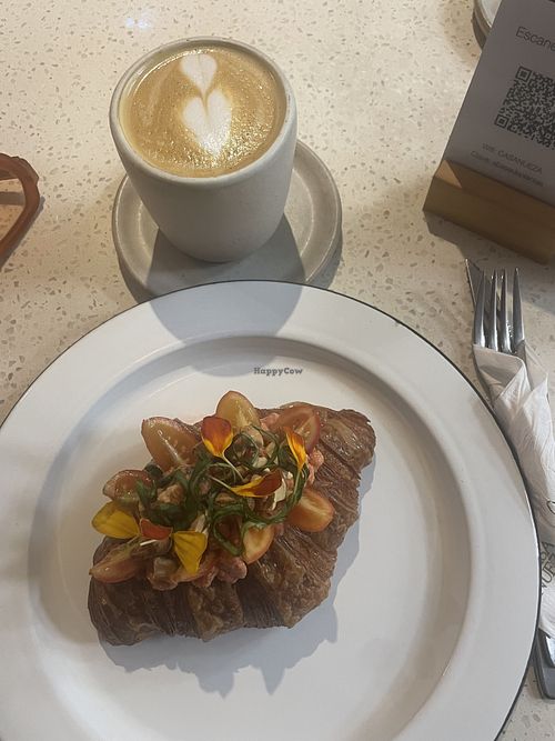 Home made almond milk flat white and tofu filled croissant  at Casa Nueza in Buenos Aires