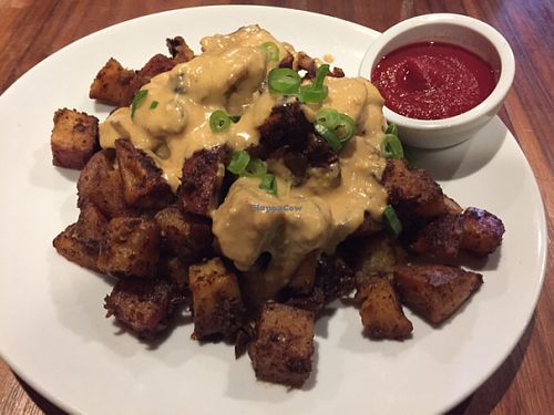 Patatas Bravas (roasted red potatoes, cashew cheese and scallions) at Real Food Daily - Pasadena in Pasadena