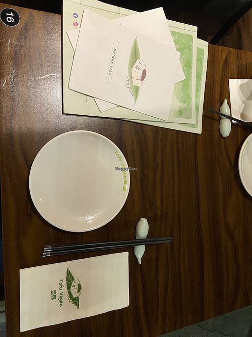 Place setting and menus  at Tofu Vegan - Spitalfields in East London