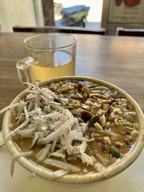 Fresh power pudding (small size) and herbal tea (large size)  at Sat Saheb in Kathmandu