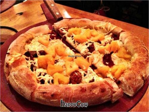 Small pizza with Indian curry sauce, pineapples, figs, dates, and avocados (added later) and vegan cheese at Picazzo's Organic Italian Kitchen in Sedona