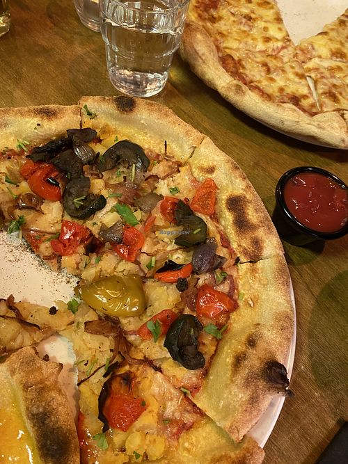Pizza with lovely toppings   at Nico's Pizzeria Restaurant in Belfast