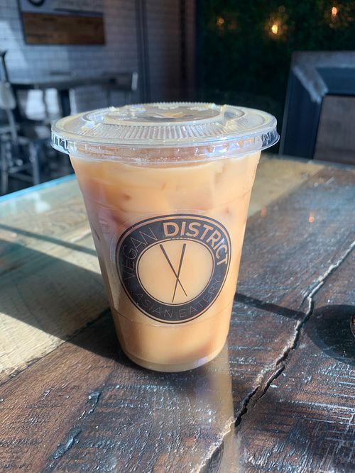 Iced passion fruit green tea with popping boba pearls at Vegan District Asian Eatery in Loma Linda