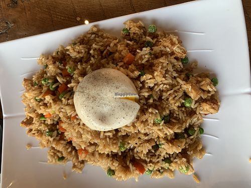 Chicken fried rice with vegan poached egg on top  at Vegan District Asian Eatery in Loma Linda