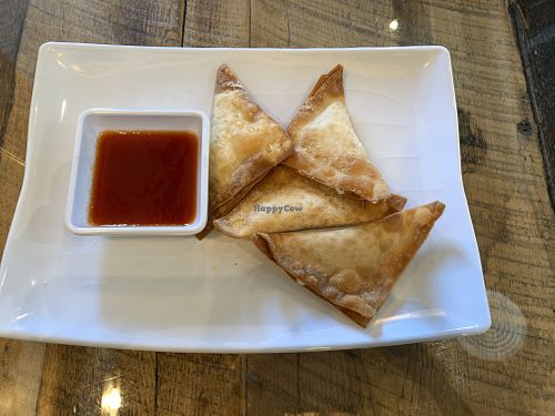 Vegan cream cheese wontons with sauce  at Vegan District Asian Eatery in Loma Linda