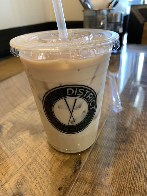 Iced caramel oat milk latte   at Vegan District Asian Eatery in Loma Linda