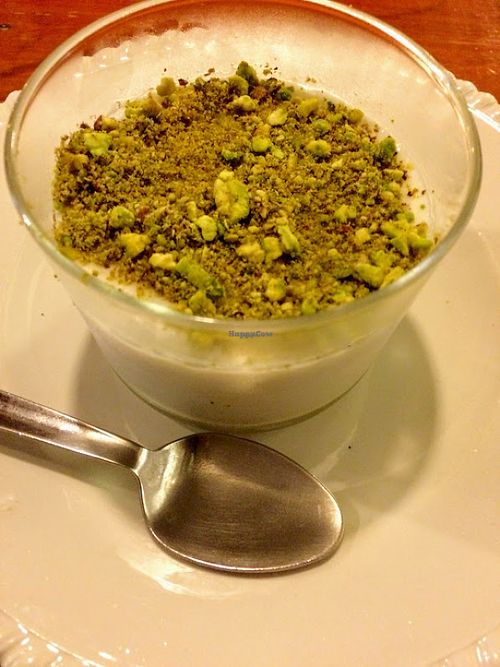Vegan Lebanese flan made with almond milk and topped with pistachios at Grain de Sable in Marseille
