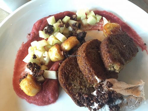 Gluten-free vegan banana french toast with rhubarb compote, fruit salad & coconut cream on the side.  at The Acorn in Vancouver