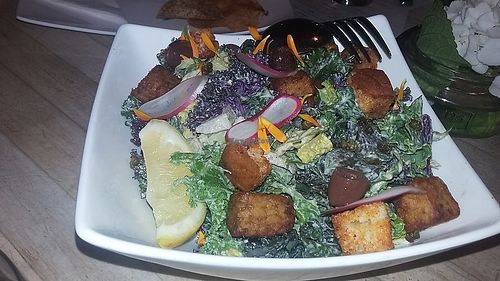 Kale Salad, Tempeh, Smoked Paprika Croutons, Crispy Capers, Black Olives, Caesar Dressing at The Acorn in Vancouver