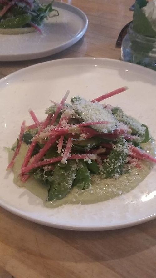 Sumac Lemon Dressed Snap Peas, Cucumber Cashew Créme Fraiche, Wild Greens, Pickled Cucumber, Shaved Hazelnut * at The Acorn in Vancouver