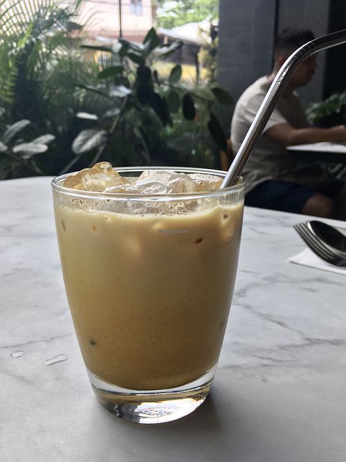 Golden mylk (soy milk, turmeric, ginger, black pepper, vanilla, coconut sugar)  at Ver De in El Nido