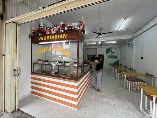 Stall front showing dishes  at Home Veggie in Batam