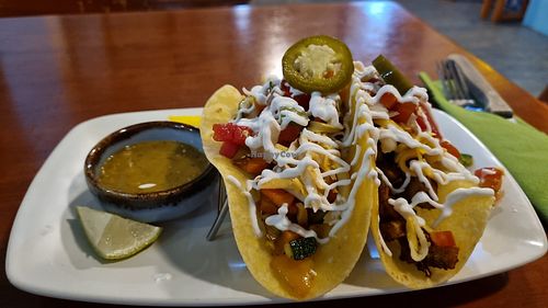 Sort tacos with vegan cheese and tofu chorizo. at La Casita in Chiang Mai