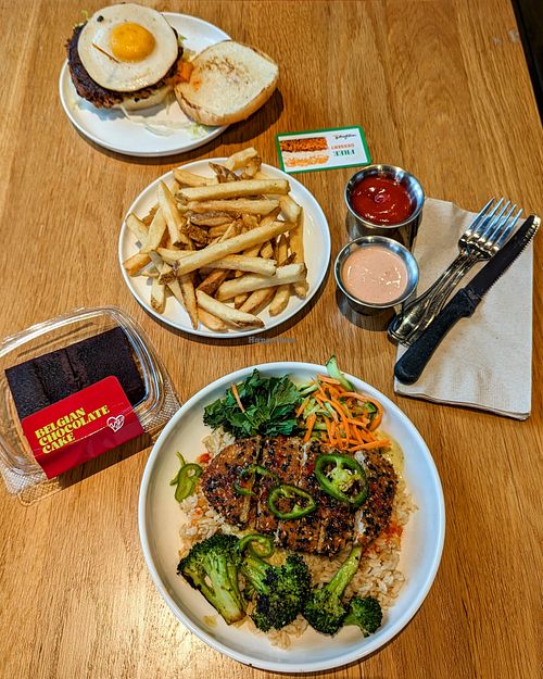 Sunrise Kimchi Burger with Golden Fries; Far East Thai Chick'n; Belgian Chocolate Cake at Veggie Grill by Next Level in Portland
