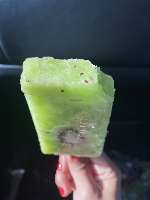 Vegan Kiwi Popsicle w/Bite Taken 😛 #Veganuary at Paleteria Neveria La Flor de Michoacan in Riverbank