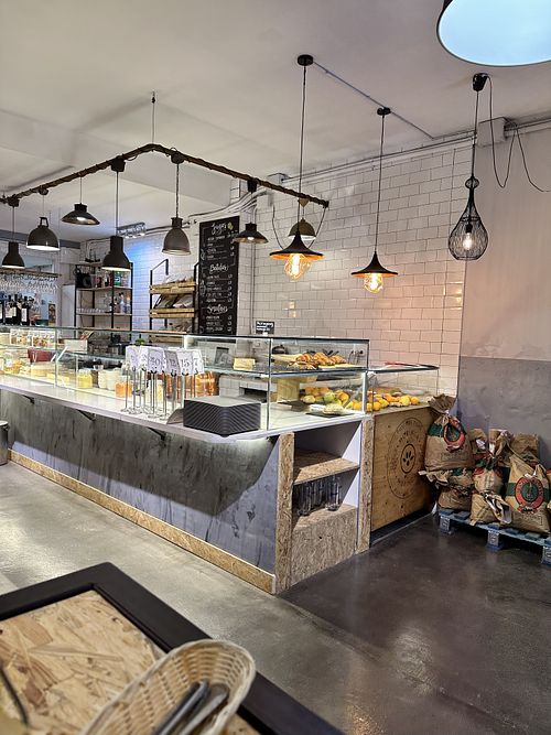 The counter with English and Spanish language menu  at Moringa in Barcelona