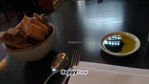 Basket of bread.  olive oil was infused and bread had olives in at The Gate - Islington in London