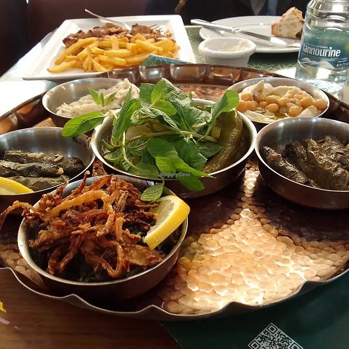 Baba ganouj, hummus, stuffed chard, chicory greens with fried onions, stuffed grape leaves, garlic paste-toom, French fries  #Veganuary at Hallab 1881 قصر الحلو in Tripoli