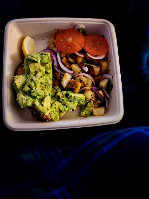 Avocado toast with potatoes topped with purple onions and tomatoes at First Watch in League City