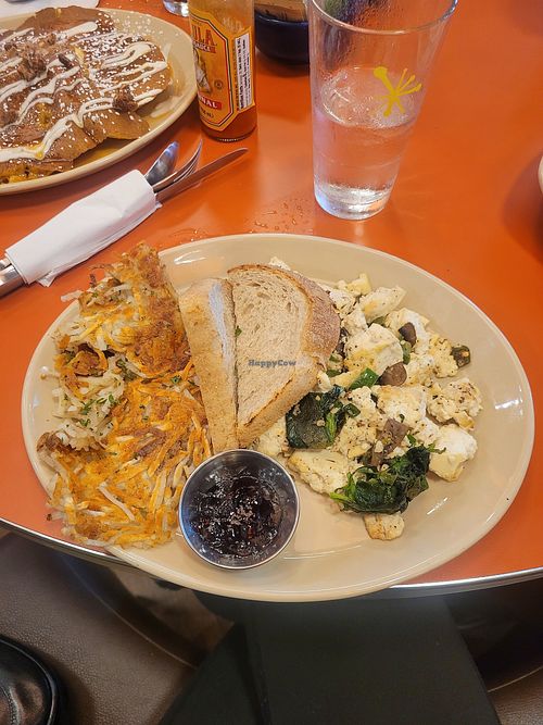 Tofu scramble (mushrooms, spinach, jalapenos) with sourdough, jam, and hashbrowns #Veganuary at Snooze - Monroe Dr in Atlanta