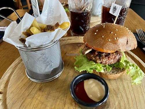 Beyond burger with vegan mayonnaise and fries   at Golden Prague Pub in Puerto Ayora