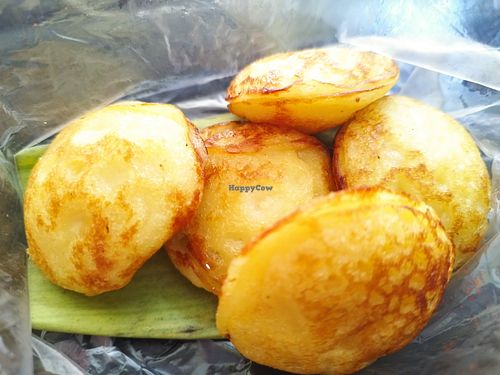 In front of the shop they're making some sweets 😍 at Kaun Im Yok Vegan Restaurant - H&H in Vang Vieng