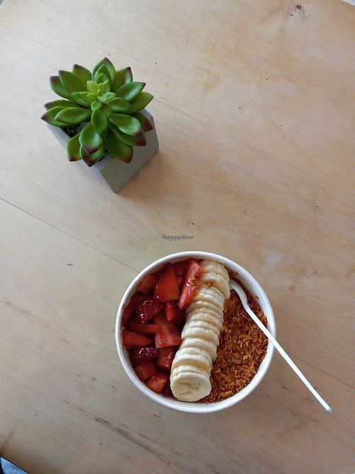 superfood açaí bowl topped with strawberries, bananas and toasted coconut 🥥  🍓   at Eat Well Kitchen in Marblehead
