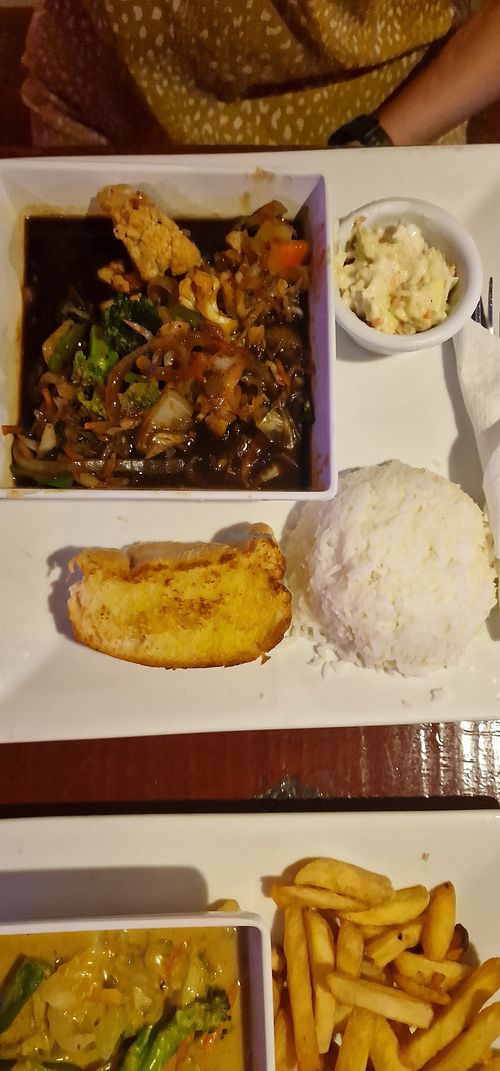 Jerk dish (tasted like soy sauce) at Swings Restaurant & Bar in San Pedro