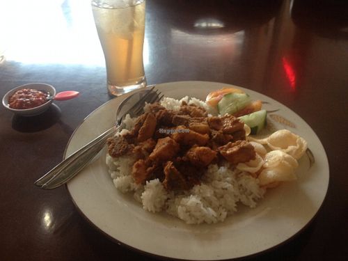 Spicy tofu & tempeh in tomato sauce, with rice at I Love Vegetarian Food - De Ra Sa in Tuban