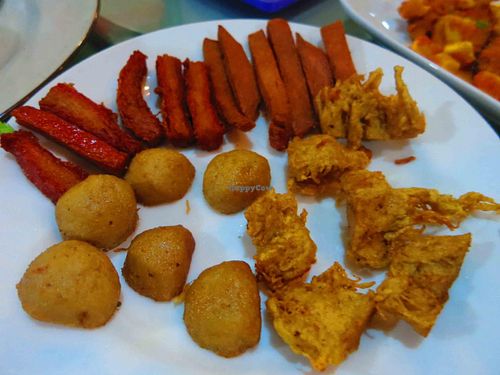 Mixed sietan faux meats. The red strips tasted just like bacon. Others were pork and chicken at I Love Vegetarian Food - De Ra Sa in Tuban