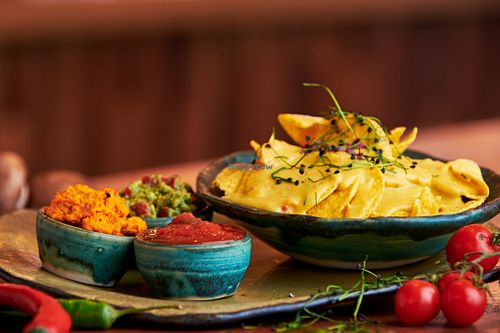 Nachos with homemade cheasy sauce, salsa sauce, guacamole and chili hummus at Nordur in Aalborg