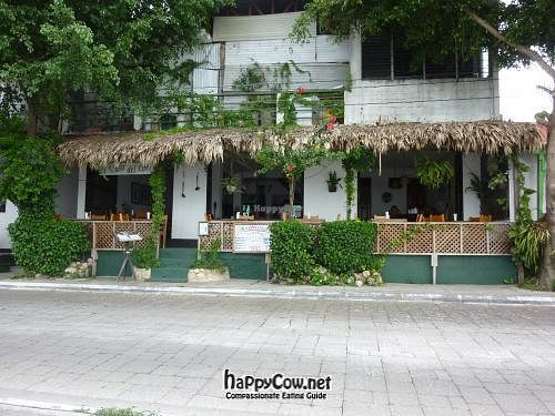 Tables facing the lake, and amazing sunset at La Villa Del Chef in Flores