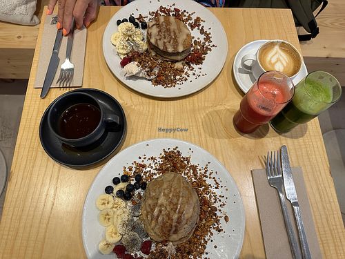 Vegan pancakes 🥞 with red beast & green boost 😋  at Numa Café - AMUN Cafe in Lisbon