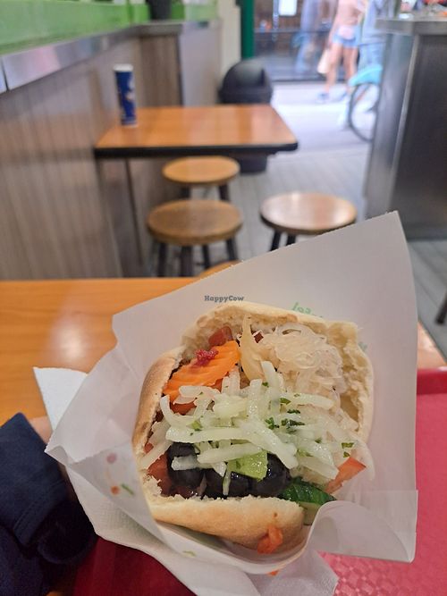 Pita stuffed with falafel and salad at Maoz - Xavier Privas in Paris