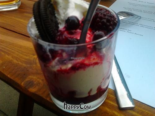 vanilla ice cream with soft fruits, cream and cookie at Wind und Wetter in Berlin