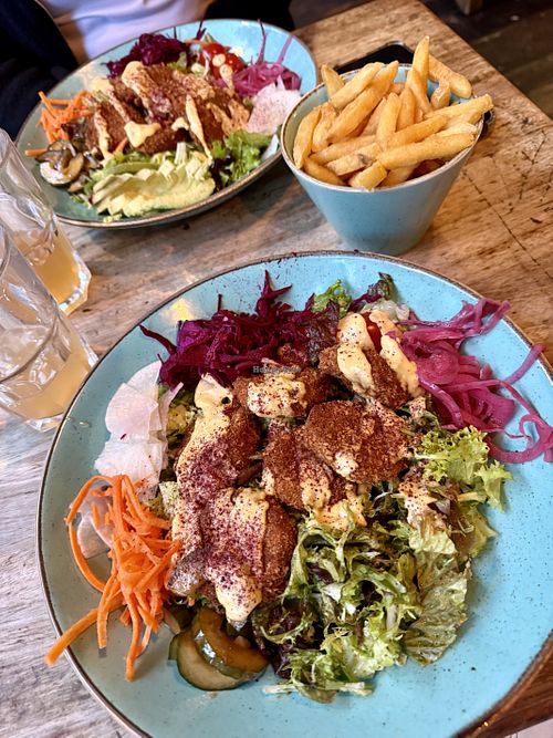 Vegan chicken salad bowls plus regular fries    at Biblos in Bristol