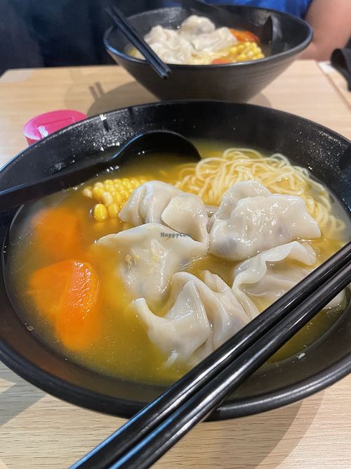 Carrot and corn base soup with dumplings and noodle  at Vegan Garden - 意素園 in Hong Kong Island