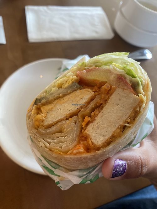 Digging In - Buffalo Chick’n’ Wrap - Half for Lunch/Half for Dinner 😛  at Veggie Grill by Next Level in Long Beach