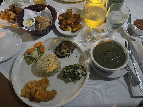 Veggies, rice, plantains, bread, and calaloo soup.  at The Fish Pot in Black Rock