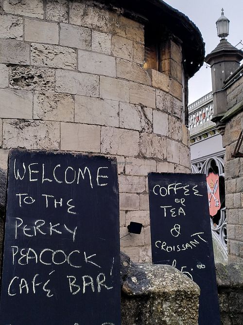 The signs (Lendal Bridge in the background) (January 2023) at The Perky Peacock in York