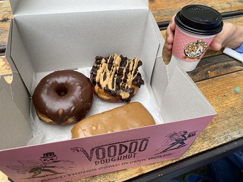Vegan doughnuts and black coffee at Voodoo Doughnut Tres in Eugene