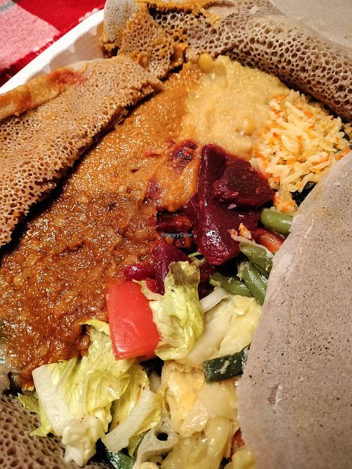 The veggie combo is more aesthetically pleasing when dining in, but just as "delish" when having take out! at Delish Ethiopian Cuisine in Seattle