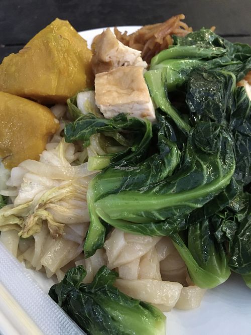 Pumpkin, tofu, napa cabbage, flat rice noodles and gai lan from the buffet   at Buffet Vegetarian & Food by Menu in Luang Prabang