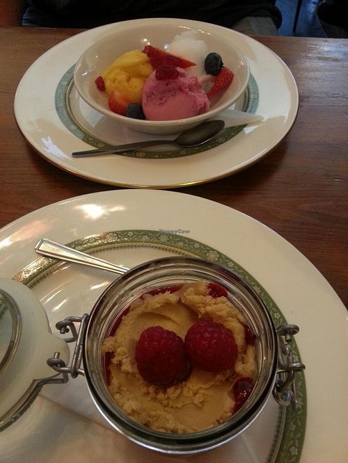 3 sorbets - champagne, mango n passionfruit, mixed berry. And peanutbutter mouse with raspberry coulis. All vegan. at Norman's Coach and Horses in London