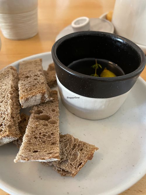 Appetizer - Bread and alive seasoned olive oil at Alma Kitchen & Coffee in Tangier