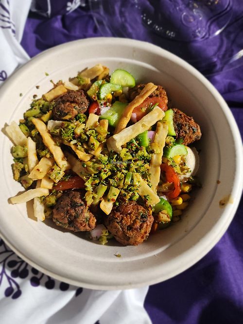 Greens and Grains Bowl 
(extra falafel, veggies, pita crisps, balsamic date vinaigrette and lemon herb tahini) at CAVA in Webster