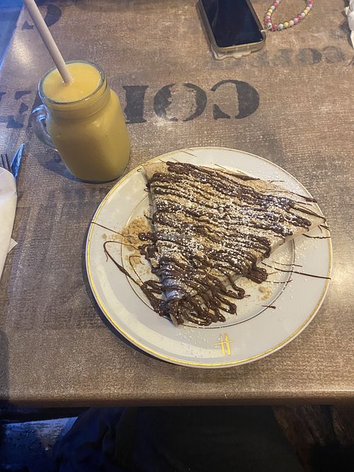 Vegan biscuit crepe with tropical smoothie  at Quick Crepes in Bury
